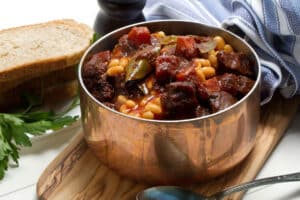 stone soup recipe in silver pot with veggies and meat