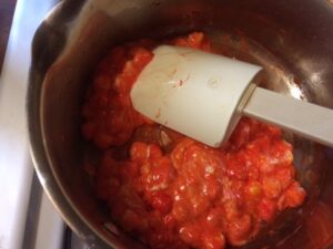 Stirring the Color into the Marshmallows for Rice Krispies Pumpkins