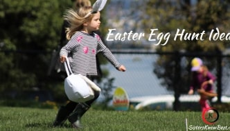 young girl with bunny ears and basket running on grass
