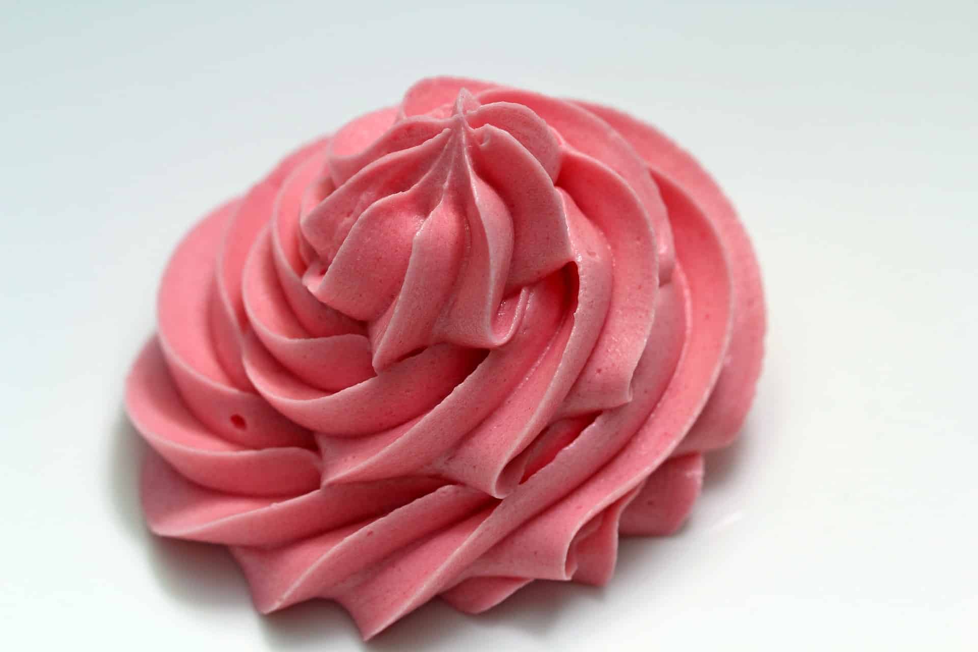 frosting swirled to resemble a pink flower