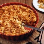 macaroni and cheese in red round serving dish
