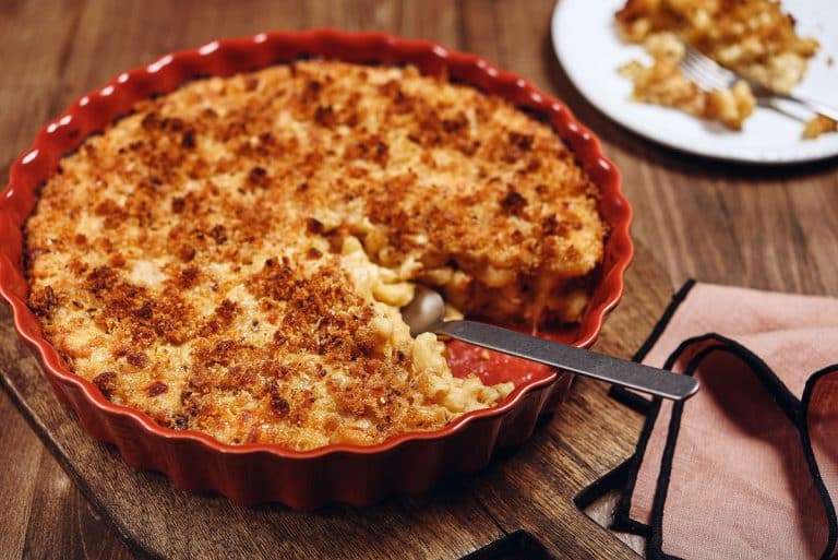 macaroni and cheese in red round serving dish