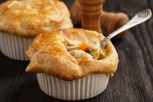 Turkey pot pie with carrot, grean peas and cheese.