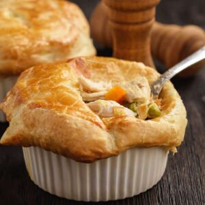 Turkey pot pie with carrot, grean peas and cheese.