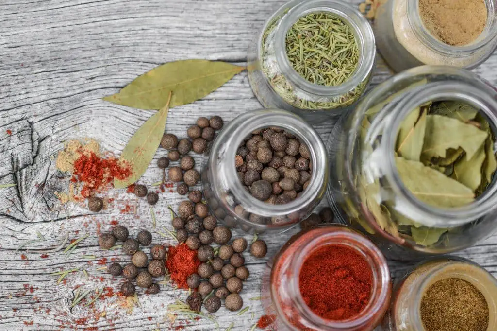 glass jars of spices to create spice blends 