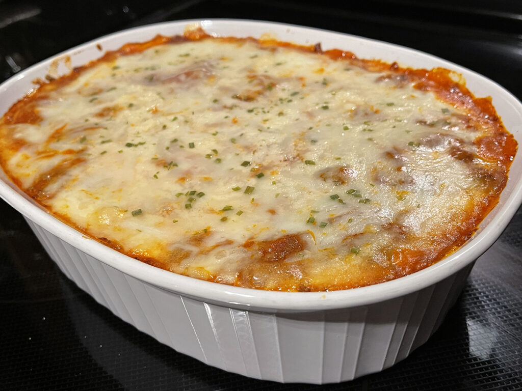 keto friendly lasagna with cheese in white casserole dish