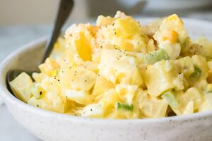 potato salad in a white bowl