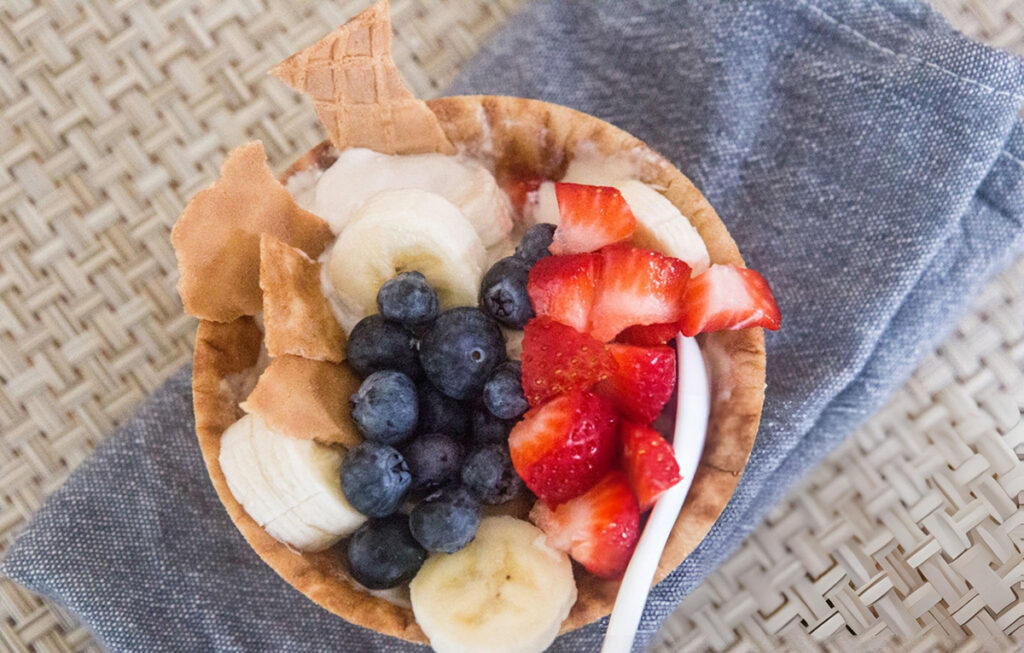 ice cream cone with berries and banana for campfire food