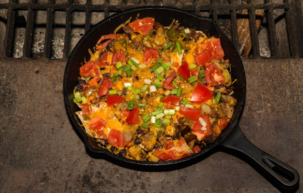 nachos in cast iron pan for easy campfire food