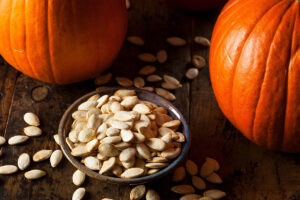 pumpkin seeds in black bowl