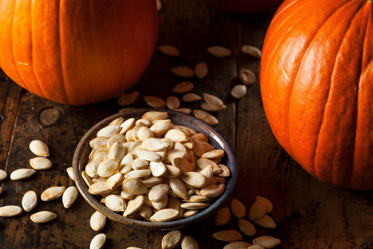 pumpkin seeds in black bowl